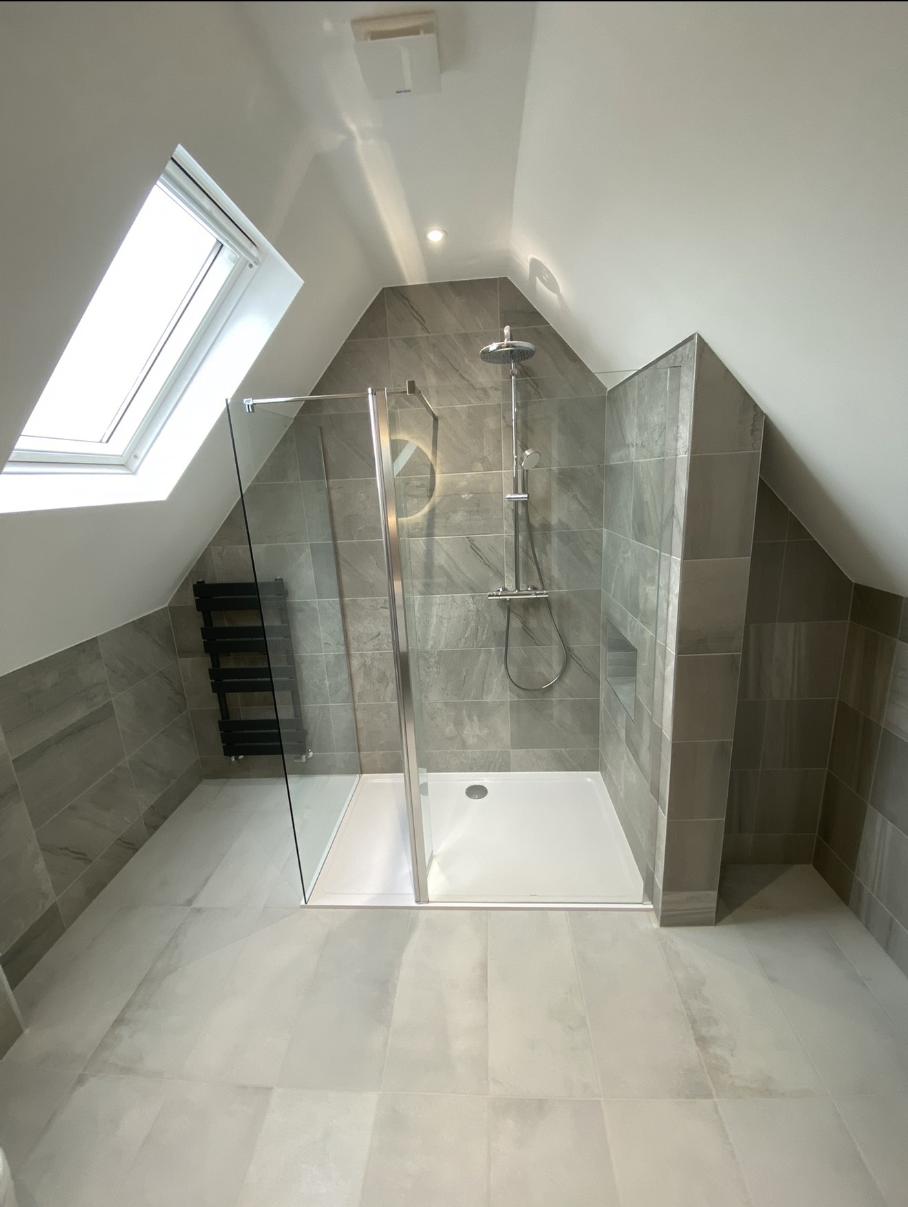 Completed loft shower room with rooflight