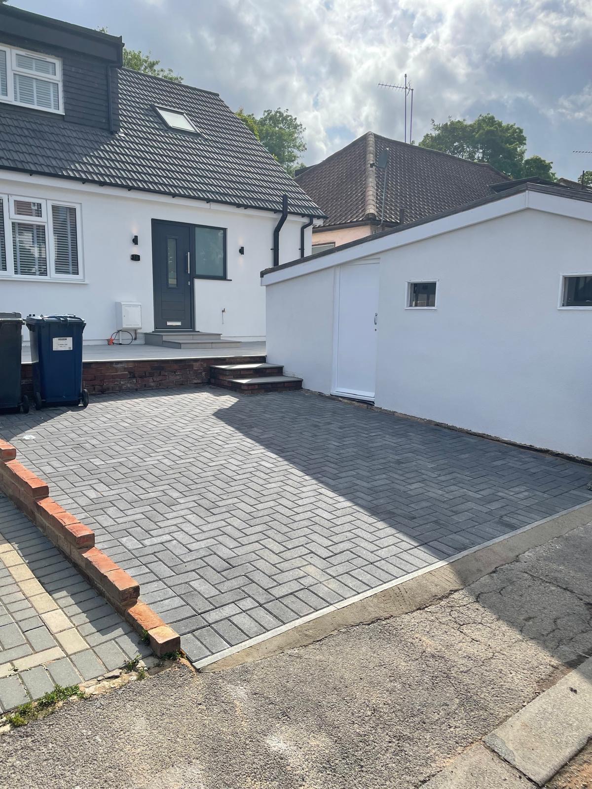 Completed loft conversion exterior and driveway